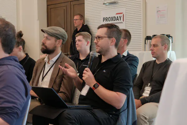 An attendee asking a question with the microphone