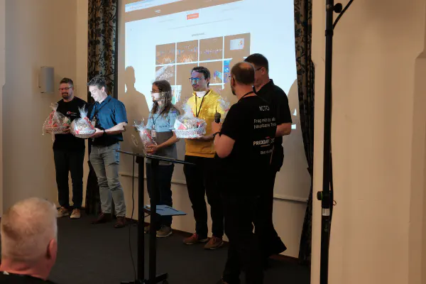 The sponsor talks on stage